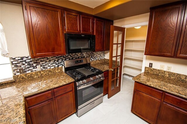 2105 Harbor Cliff Dr, Las Vegas, NV 89128 - kitchen with black microwave, stainless steel gas range oven, backsplash, dark stone countertops, and dark brown cabinets