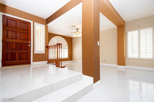 entrance foyer featuring visible vents, marble finish floor, baseboards, and ceiling fan