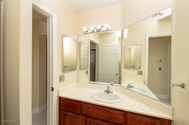 bathroom featuring visible vents and vanity