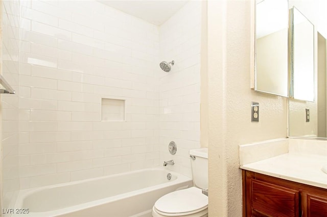 full bathroom with a textured wall, shower / bath combination, vanity, and toilet
