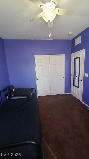 bedroom featuring baseboards, a closet, carpet flooring, a ceiling fan, and visible vents