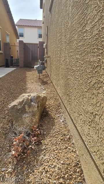 view of home's exterior featuring fence and stucco siding