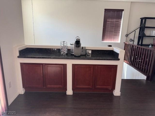 bar featuring dark wood-style flooring