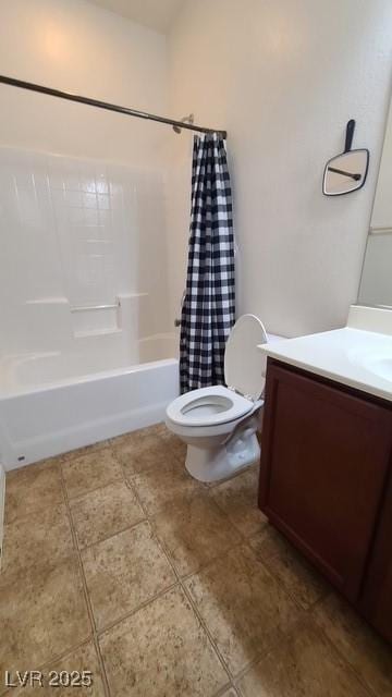 bathroom with tile patterned flooring, shower / tub combo, vanity, and toilet