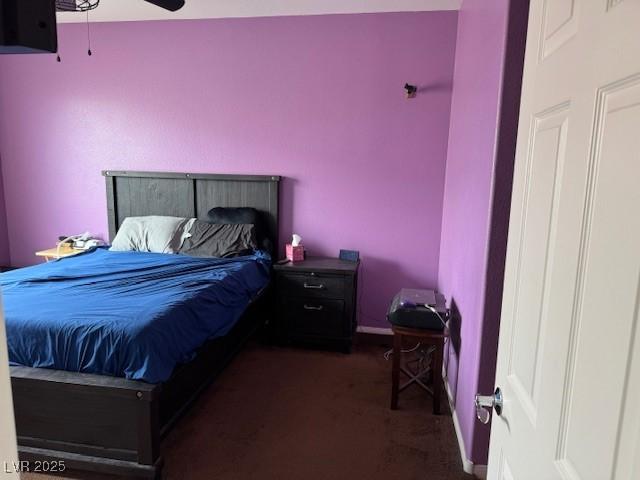 bedroom with carpet flooring, baseboards, and a ceiling fan