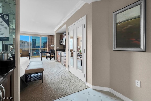 135 E Harmon Ave Unit 2515, Las Vegas, NV 89109 - corridor with french doors, a desk, ornamental molding, baseboards, and a city view