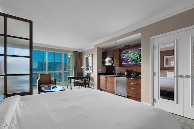 135 E Harmon Ave Unit 2515, Las Vegas, NV 89109 - bedroom with crown molding, refrigerator, and bar with sink