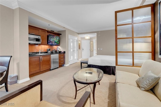 135 E Harmon Ave Unit 2515, Las Vegas, NV 89109 - living area with wet bar, ornamental molding, baseboards, and light colored carpet