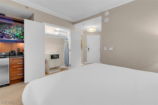 135 E Harmon Ave Unit 2515, Las Vegas, NV 89109 - bedroom with refrigerator and crown molding
