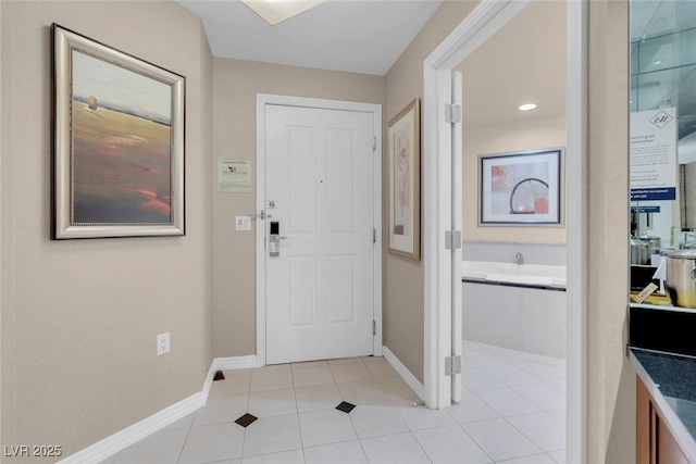 135 E Harmon Ave Unit 2515, Las Vegas, NV 89109 - foyer featuring baseboards and light tile patterned flooring