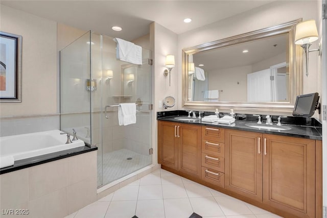 135 E Harmon Ave Unit 2515, Las Vegas, NV 89109 - full bathroom with a shower stall, a bath, double vanity, tile patterned flooring, and recessed lighting