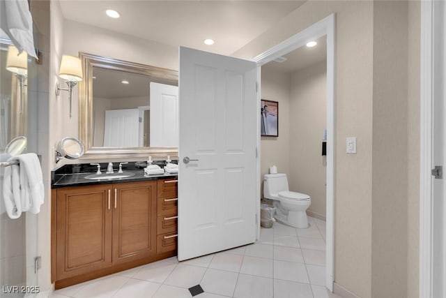 135 E Harmon Ave Unit 2515, Las Vegas, NV 89109 - bathroom featuring toilet, vanity, tile patterned floors, recessed lighting, and baseboards