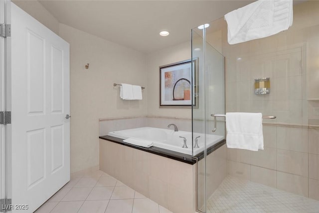 135 E Harmon Ave Unit 2515, Las Vegas, NV 89109 - bathroom with tile patterned floors, a shower stall, a bath, and recessed lighting