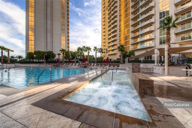 135 E Harmon Ave Unit 2515, Las Vegas, NV 89109 - community pool featuring a community hot tub and a patio area