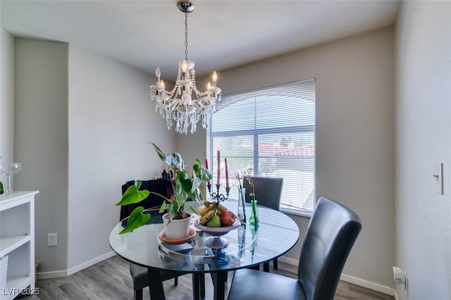 698 S Racetrack Rd Unit 1521, Henderson, NV 89015 - dining room with baseboards, wood finished floors, and a chandelier