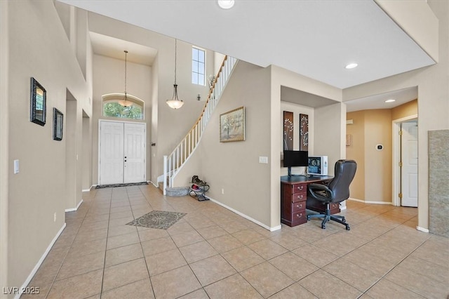 8828 Monte Oro Dr, Las Vegas, NV 89131 - entryway featuring light tile patterned floors, recessed lighting, stairway, and a towering ceiling