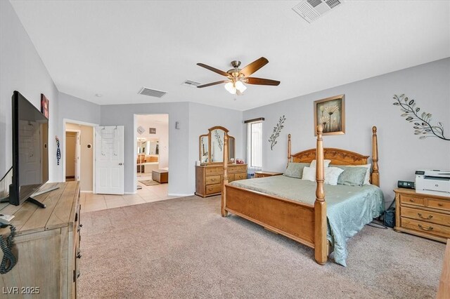 8828 Monte Oro Dr, Las Vegas, NV 89131 - bedroom with light colored carpet, ceiling fan, and ensuite bathroom