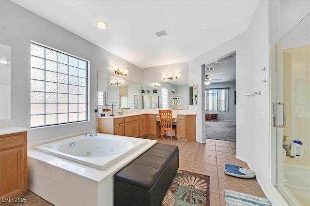 8828 Monte Oro Dr, Las Vegas, NV 89131 - full bathroom with vanity, a jetted tub, tile patterned floors, ceiling fan, and a shower stall