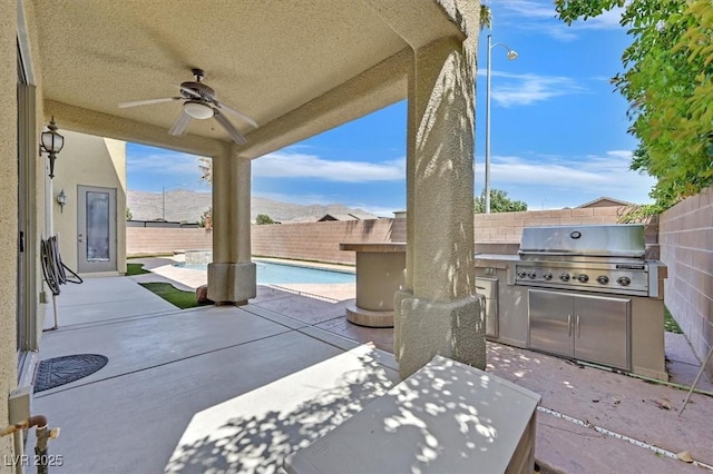 8828 Monte Oro Dr, Las Vegas, NV 89131 - fenced backyard featuring area for grilling, a ceiling fan, and a patio area
