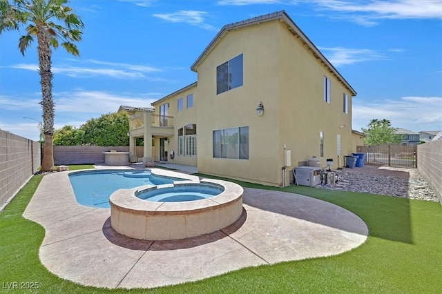 8828 Monte Oro Dr, Las Vegas, NV 89131 - rear view of house featuring stucco siding, a patio, a fenced backyard, and a balcony