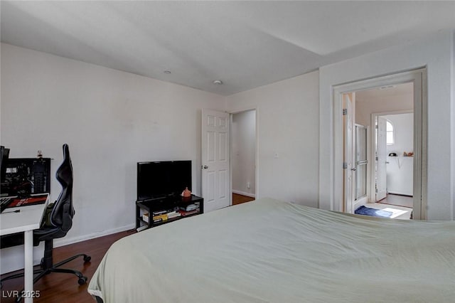 4777 Mereworth Ct, Las Vegas, NV 89130 - bedroom featuring baseboards and dark wood-style floors