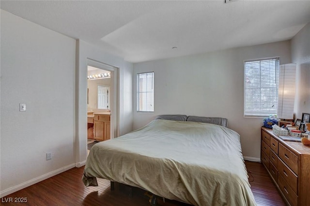 4777 Mereworth Ct, Las Vegas, NV 89130 - bedroom with multiple windows, baseboards, and dark wood finished floors