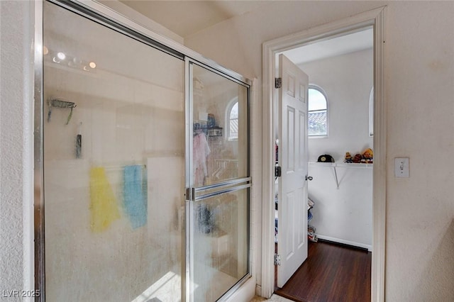 4777 Mereworth Ct, Las Vegas, NV 89130 - bathroom featuring a stall shower and wood finished floors