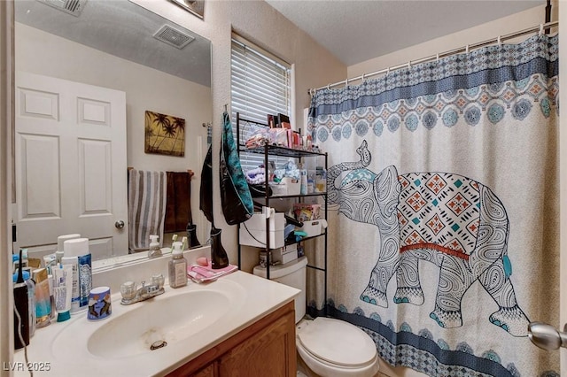4777 Mereworth Ct, Las Vegas, NV 89130 - full bath with visible vents, toilet, vanity, and a shower with curtain