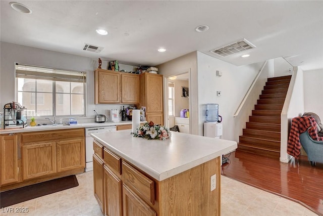 4777 Mereworth Ct, Las Vegas, NV 89130 - kitchen with light countertops, white dishwasher, and visible vents