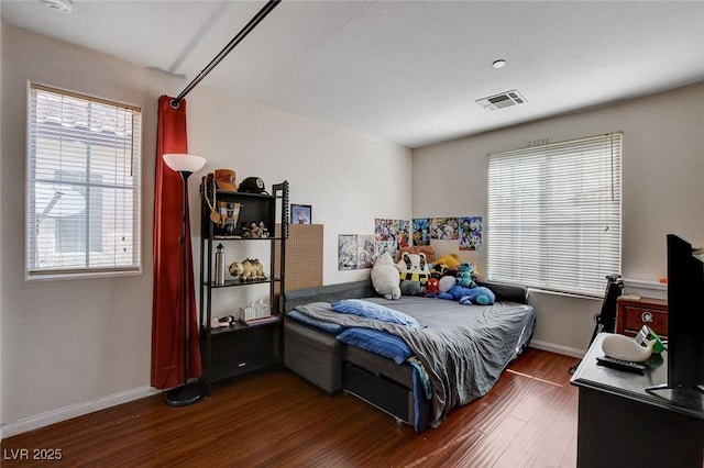 4777 Mereworth Ct, Las Vegas, NV 89130 - bedroom with wood finished floors, baseboards, and visible vents
