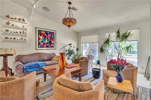living room featuring visible vents, rail lighting, and light tile patterned floors