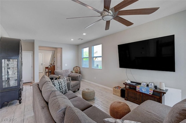 living room with recessed lighting, baseboards, and ceiling fan