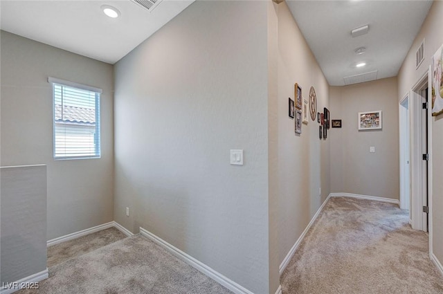 hallway with recessed lighting, carpet floors, and baseboards