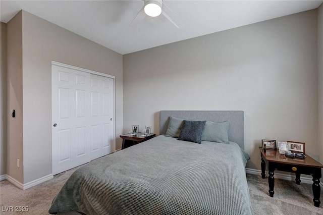 bedroom featuring ceiling fan, light carpet, and baseboards