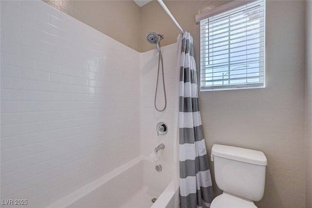 full bathroom featuring shower / tub combo with curtain and toilet