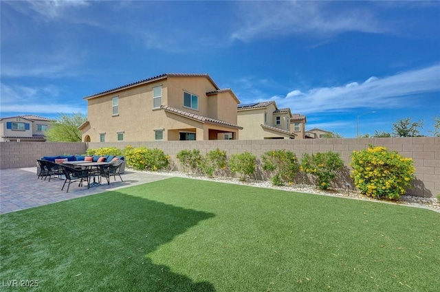 view of yard featuring outdoor lounge area, a patio area, and a fenced backyard