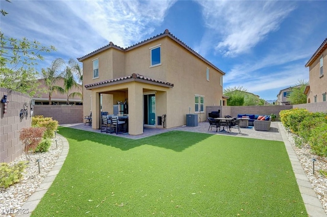 rear view of property with a patio area, central air condition unit, outdoor lounge area, a fenced backyard, and stucco siding