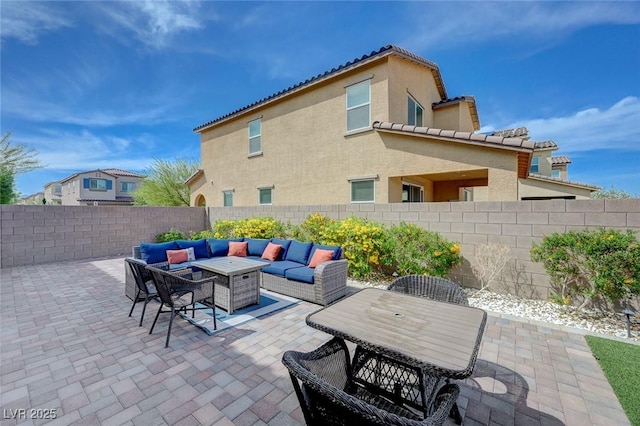 view of patio featuring outdoor lounge area and a fenced backyard