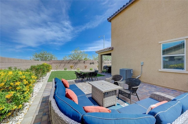 view of patio / terrace featuring an outdoor living space, a fenced backyard, outdoor dining space, and cooling unit