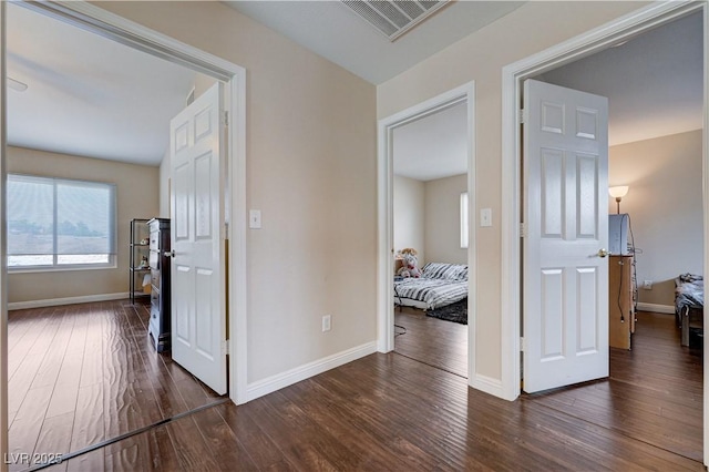 11120 Whooping Crane Ln, Las Vegas, NV 89144 - corridor featuring dark wood-type flooring and baseboards