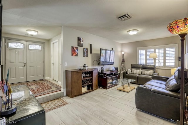 living area featuring visible vents