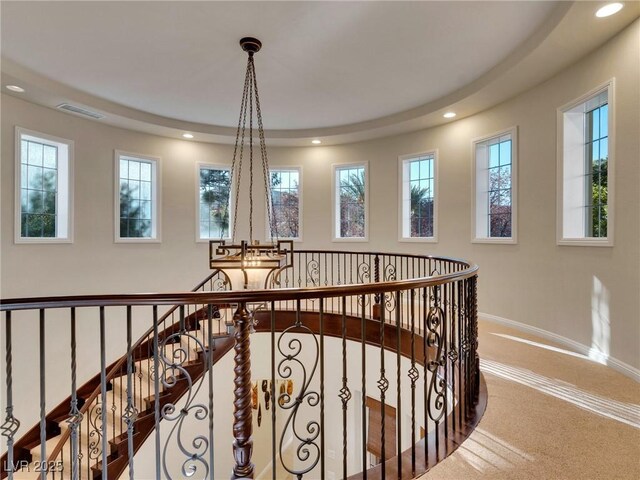 corridor with recessed lighting, carpet, visible vents, an upstairs landing, and baseboards