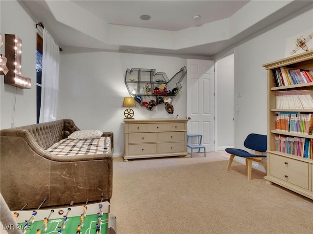 sitting room featuring baseboards and carpet