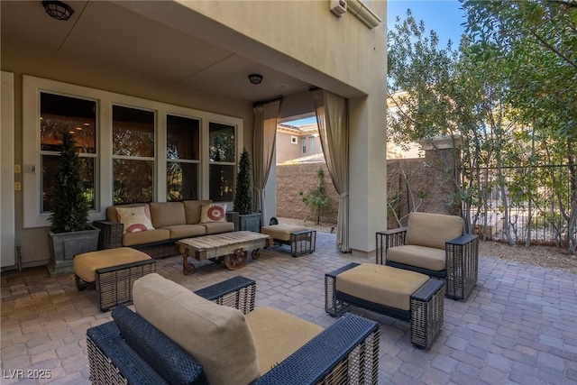 view of patio / terrace with fence and an outdoor living space