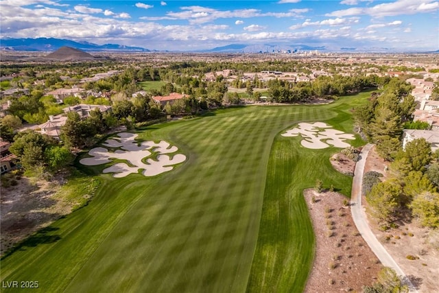 birds eye view of property with view of golf course, a residential view, and a mountain view
