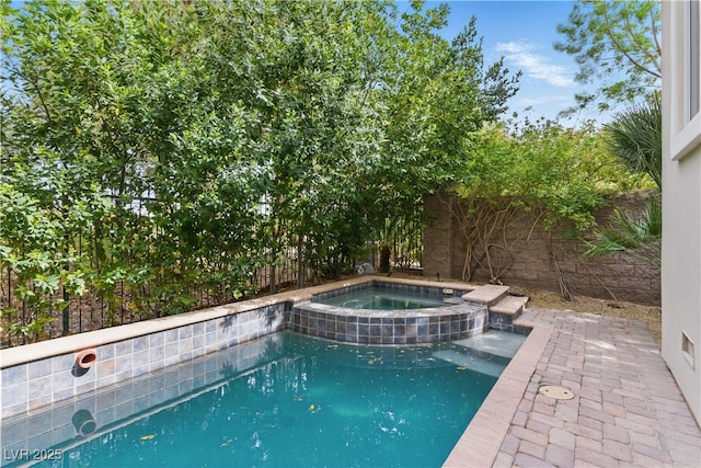 view of pool featuring a fenced backyard, a fenced in pool, and an in ground hot tub