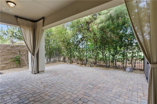 view of patio / terrace featuring fence