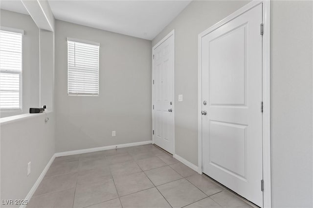 2293 Teatro Ave, Henderson, NV 89044 - unfurnished bedroom with baseboards and light tile patterned floors