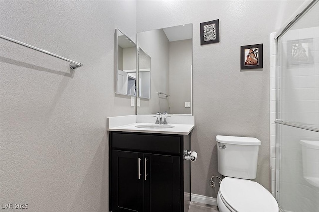2293 Teatro Ave, Henderson, NV 89044 - full bath featuring vanity, a textured wall, toilet, and tiled shower