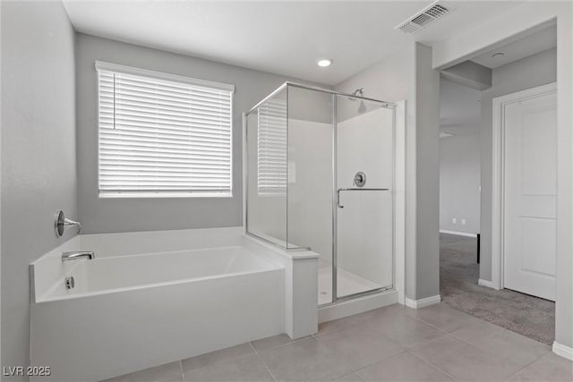 2293 Teatro Ave, Henderson, NV 89044 - bathroom featuring a garden tub, visible vents, tile patterned flooring, a stall shower, and baseboards